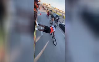 Cyclist Pulls Off Both The Wildest And Most Idiotic Stunt Simultaneously 