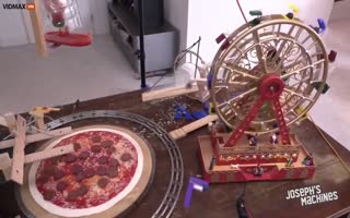 This Pizza-Making Machine In Bat$hit Crazy Cool