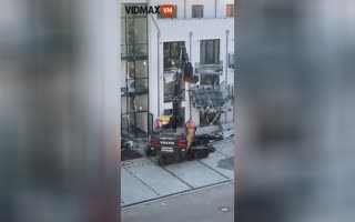 Excavator Operator Obliterates Building Balconies as a Coping Method for a Crappy Boss