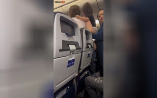 Mother of the Year Tries to Duke it out with a Flight Attendant Whilst Holding her Baby