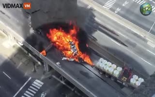 Buildings View Snaps into Satans Farts after a 18-Wheeler Carrying Gas Erupts in Flames