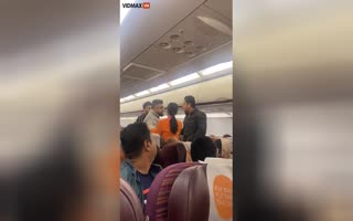 Watch As A Bunch Of Male Passengers Get Slap-Happy Aboard A Thai Airlines