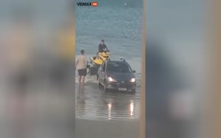 Idiots Use a 4 Wheel SUV on a Beach to Put a Jet Ski in the Water, You Guess What Happens Next