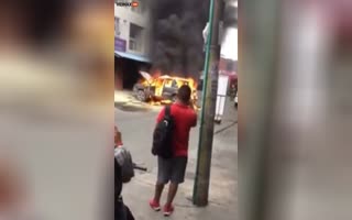 SUV Explodes Like A Bomb As People Stand Around And Film