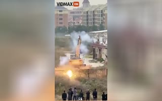 Chinese Man Uses Fireworks to Defend his Home From Demolition like a Medieval Seige