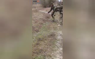 Ukrainian Soldier Clears A Russian Mine With A Boat Oar