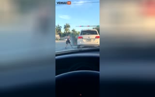 Psycho Has a Meltdown, Attacks a Car, and its Riders Over an SUV Being Over the Crosswalk