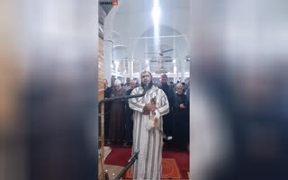 Israeli Spy(?) Attempts to Interrupt a Muslim Ceremony in the Weirdest Way Possible, Cat Ass.