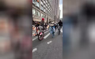 Crazy Balance! A crew of Cyclists who Rides Wheelies Around NYC Show a Teen How Kid Nails It With Some Help.