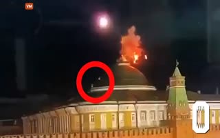 Drone Explodes Over the Kremlin as Two People Were Climbing Up Towards the Flag Waiving Over the Building