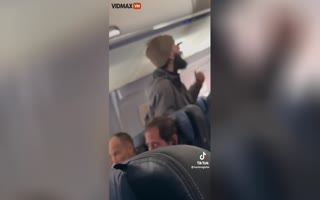 Boston to LA Passenger Meltdown, Tries to Flee the Plane with a Spoon and Gets Manhandled by Fellow Passengers