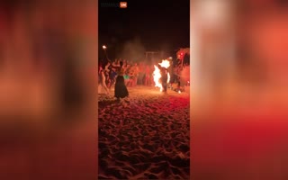 Fire Dancer Accidentally Catches Her Dress on Fire, Turns the Night Into a Different Form of Entertainment
