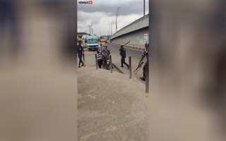 Nigerian Police Caught on Cam Cracking a Teens Skull with a Baton, Then Robbing Him of His Motorcycle