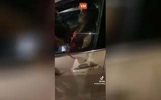 Girl Passes Out At a Redlight in the Middle of Traffic, Bystanders Forced to Smash Window to Wake Her