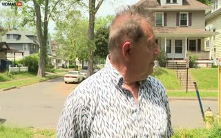 Elderly Man Doing A New Interview Doesn't Flinch As A Drive-By Shooting Happens Behind Him