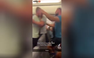 WTH? Man Freaks Out On RyanAir Flight, Tries To Open Door, Gets Tackled By Passengers