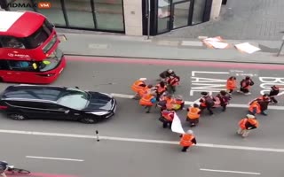 Man SNAPS! Starts Tossing Climate Activists Out of the Road Like Ragdolls