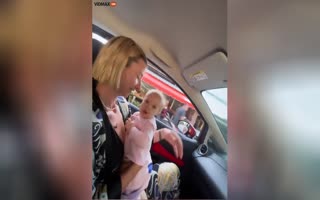 Stupid Mother Cruises Around With Baby On Her Lap Without Seatbelt