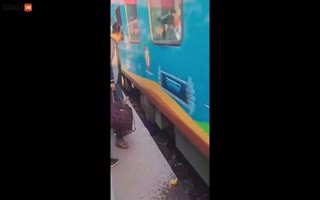 Amazing Video Shows Mother Saving Her Children Who Fell On Train Tracks Using Her Body To Shield Them As Train Speeds Over