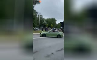 Stupid Driver Showing Off In A BMW Nearly Gets A Couple Of Pedestrians Killed