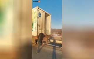 Truck Driver Almost Gets His Head Taken Off When His Trailor Doors Blow Open