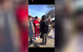 Guy Dressed As A Russian Soldier In Indiana Holding A Sign Saying 'Keep The Area White' Gets Confronted