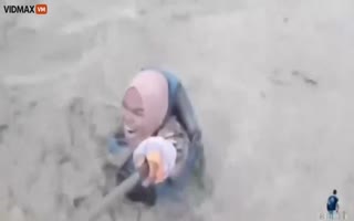 Woman Films Herself Being Taken Out By A Tidal Wave