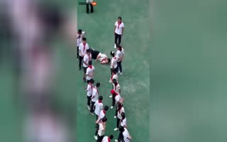 Chinese Boy Passes Out Hard While He And His Class Were Forced To Stand Outside In 95 Degree Heat For Punishment